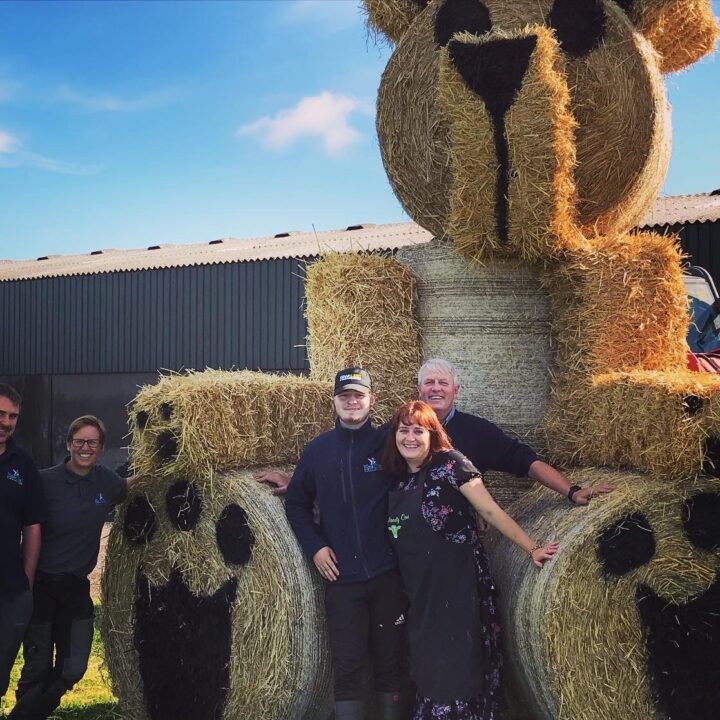 Farm family with bale bear